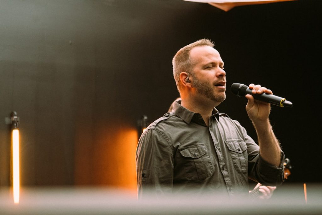 man-in-black-leather-jacket-singing-3ilhilj0cfq